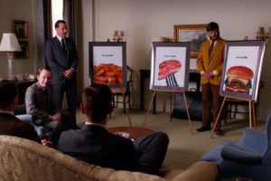 A scene from the TV show Mad Men in which the ad men pitch a campaign for Heinz Ketchup.